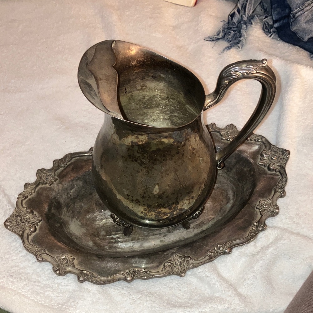 Silver pitcher and plate.
